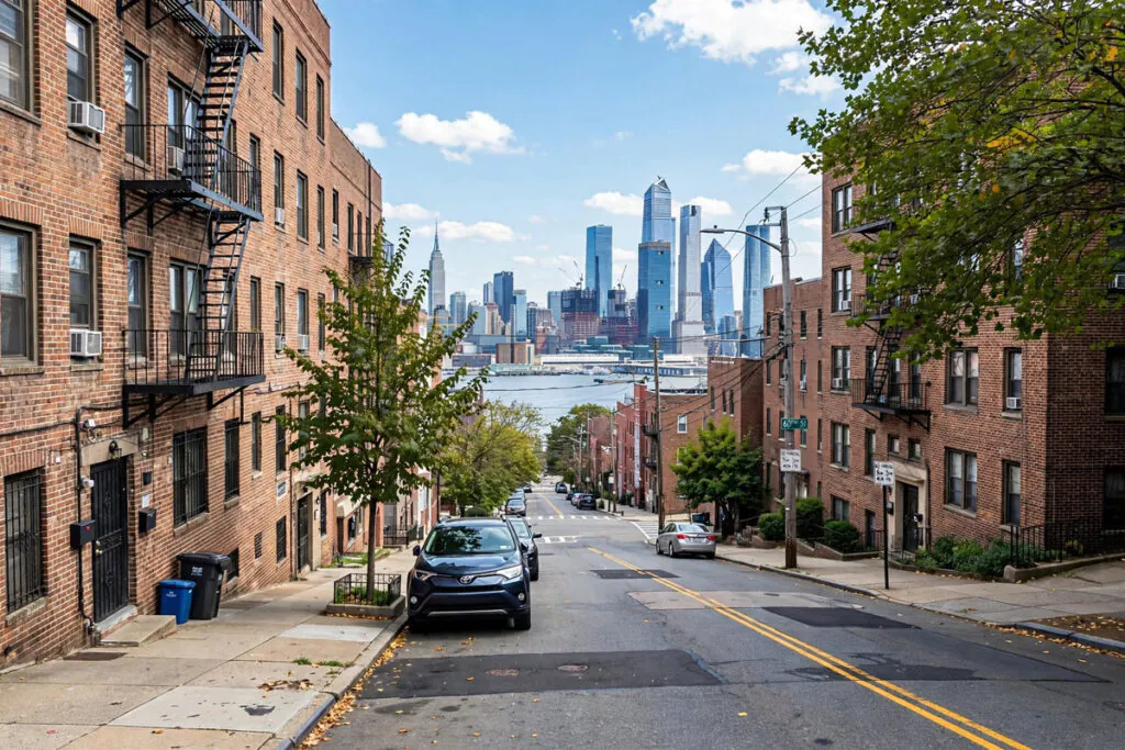 Residential street in West New York, New Jersey with Manhattan skyline in the distance
